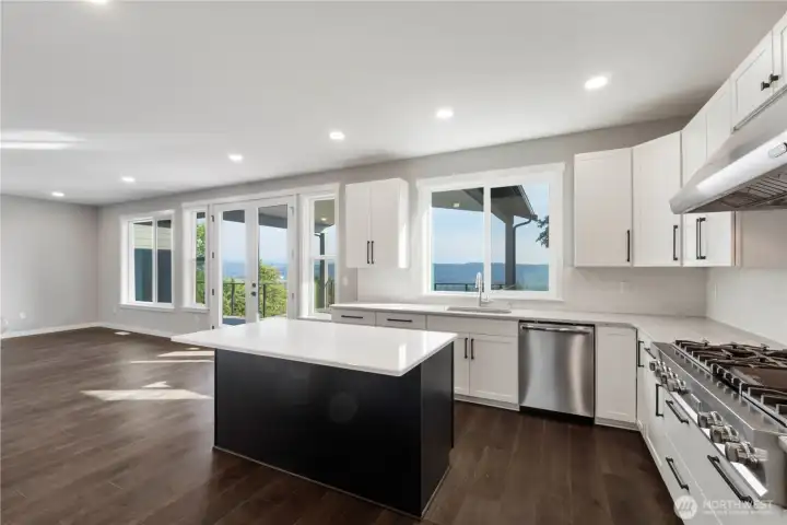 Undermount sink, shaker soft-close cabinets, ton of storage including Lazy Susans and under cabinet lighting!