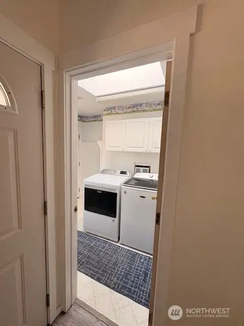 Laundry room right off the front entry way