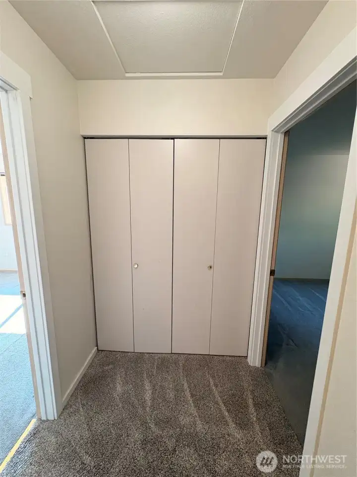 Storage closet at end of hallway