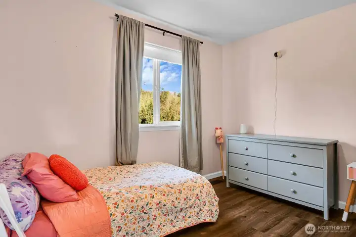 One of the three upstairs bedrooms.