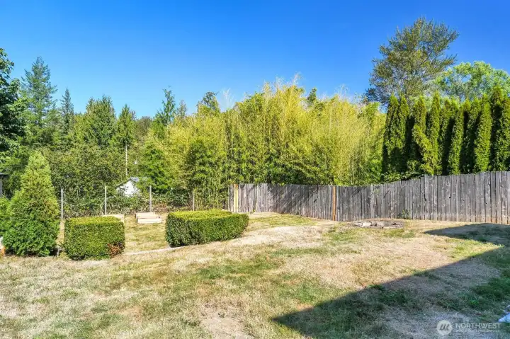 Large terraced yard with a creek and greenspace behind it! Very private! Fully fenced with a storage shed.
