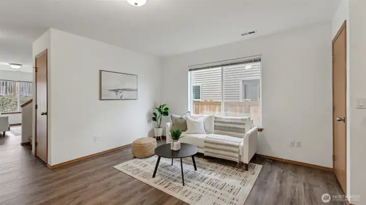 A polished yet comfortable living area with an open flow to the dining room, creating a seamless main-level experience.