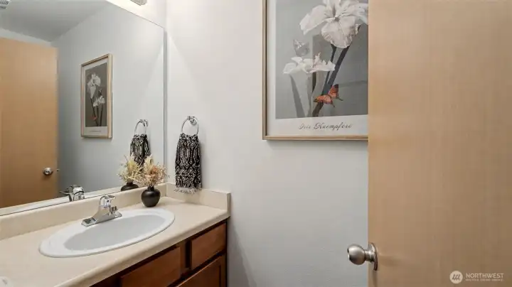 A thoughtfully placed half bath, perfect for guests and everyday ease without compromising elegance.