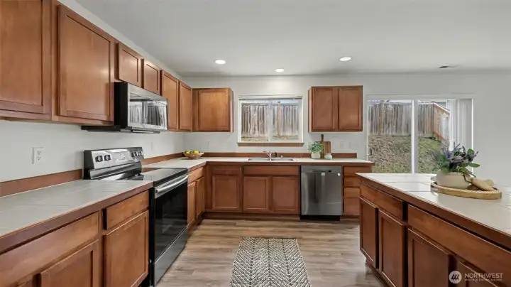 Designed for both beauty and function, this kitchen offers abundant counter space and generous storage to support everyday living and entertaining.
