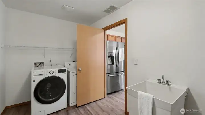 Designed for convenience and efficiency, this oversized utility space features a wash basin and full-size laundry—functional luxury at its finest.