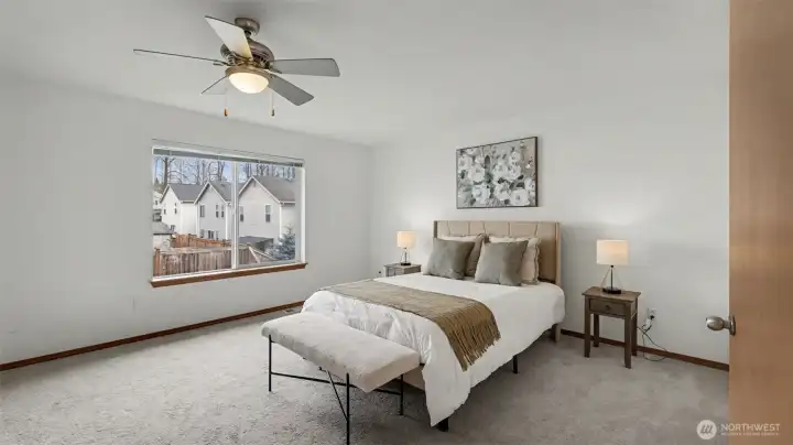 Generous in size with refined details, this primary bedroom offers a peaceful sanctuary at the heart of the home.