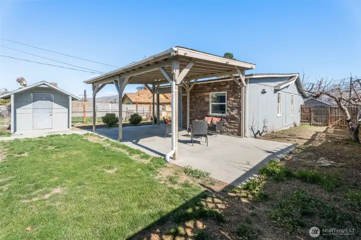 Back yard, covered patio and side yard.
