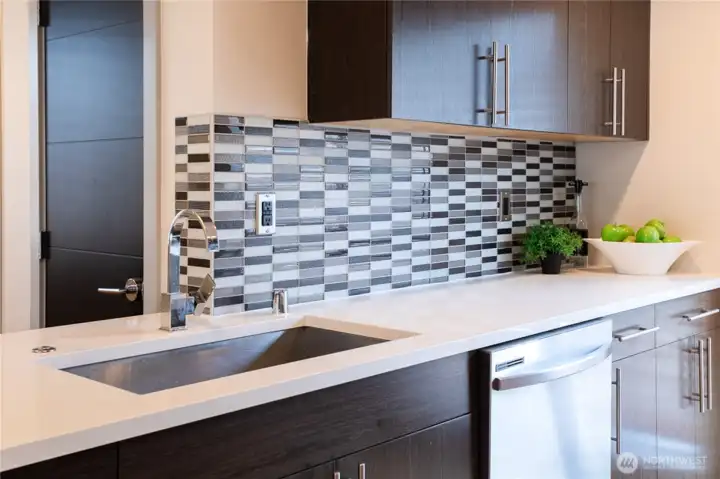 Beautiful Backsplash with undermount Stainless Sink.