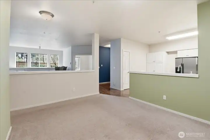 This is from the dining room looking out to the living room and kitchen.  In this picture you can see the additional pantry to the left of the refrigerator.