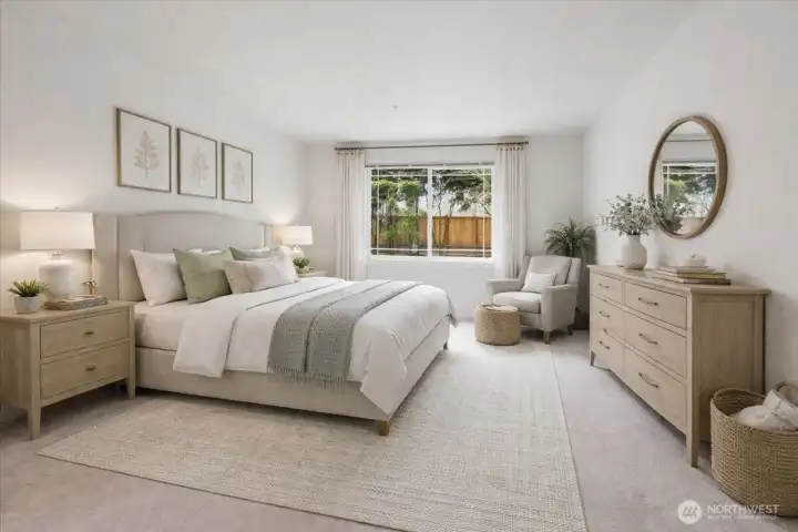 This is the primary bedroom.  It is very spacious. It can easily accommodate a king sized bed plus furniture.  This photo has been virtually staged.