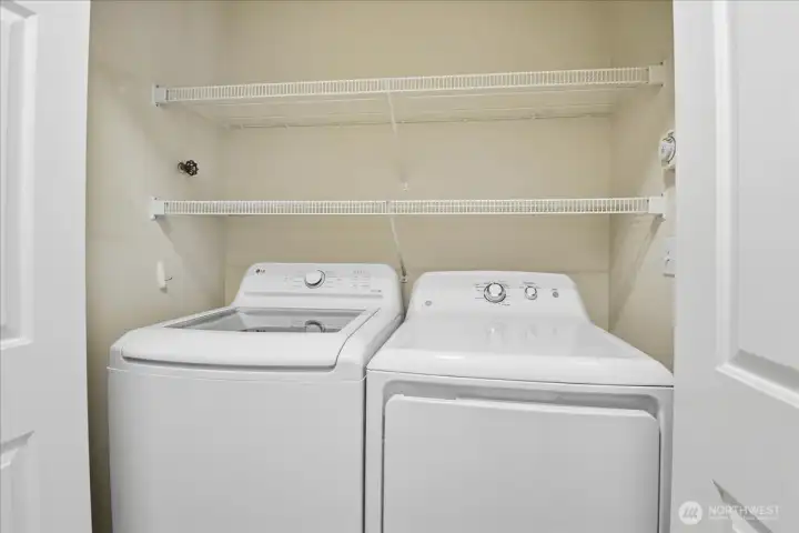 The laundry room has additional storage.  The full sized washer/dryer will stay as will all appliances.