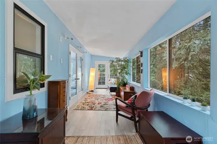 Sunroom with deck and backyard access