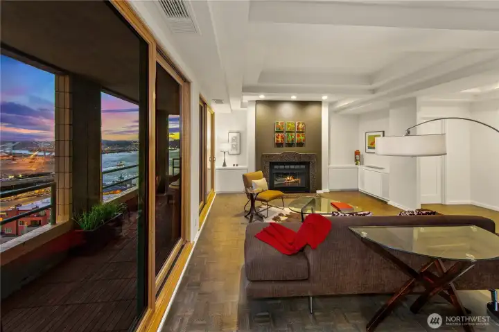 A long interior gallery connects the primary rooms of the penthouse, reinforcing the deliberate plan and the sense of a private retreat above the city.