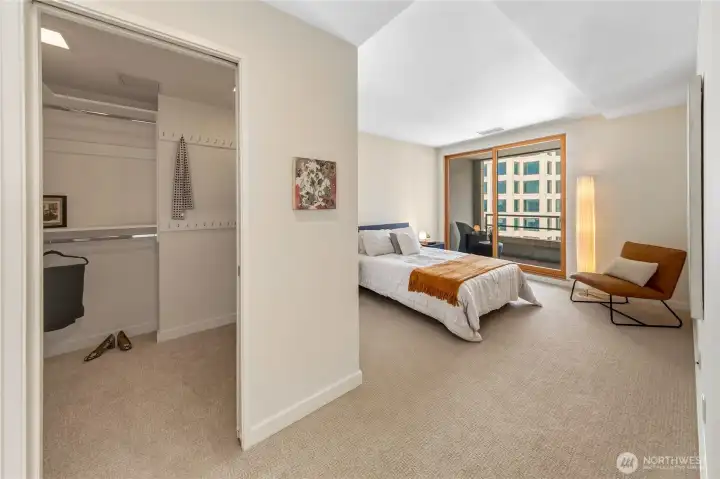 The bedroom suite connects to a dedicated dressing area and walk in closet.