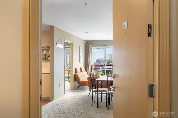 Welcoming entry into this bright, open-layout 1-bedroom condo