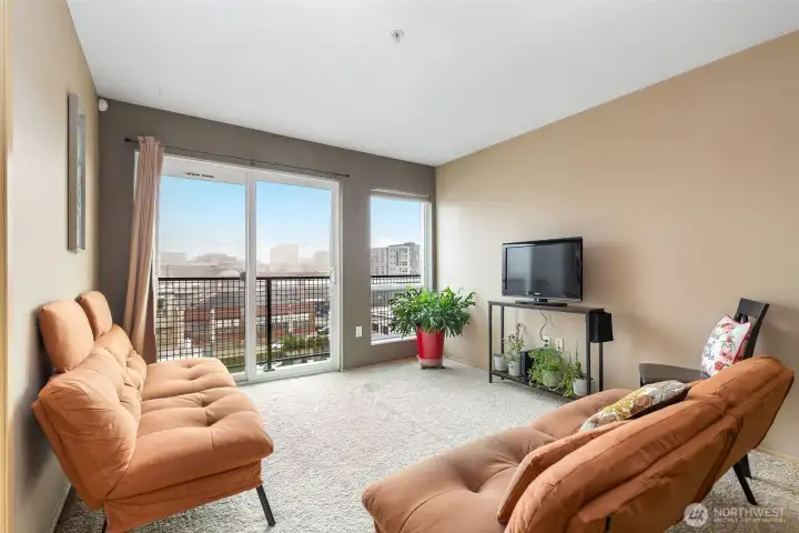 Living room with East-facing windows and downtown Everett views