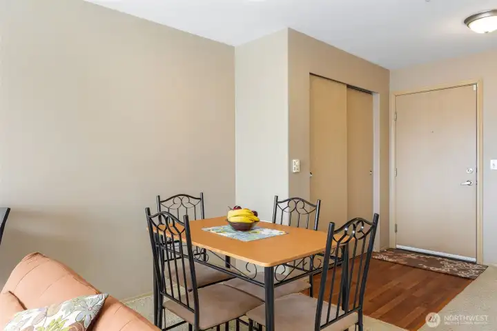 Dining area near entry with hardwood floors and ample space