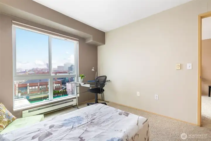 Primary bedroom with oversized closet and East-facing city views