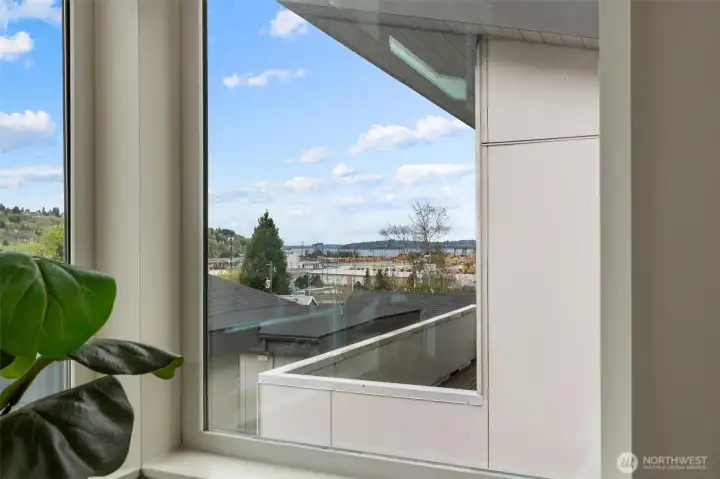 View from upper-level primary bedroom window showing territorial, city, and Duwamish Waterway outlook.
