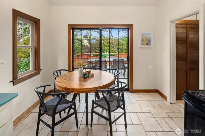 Dining space in kitchen with access to large deck directly off kitchen. Did somebody say bar-b-que?