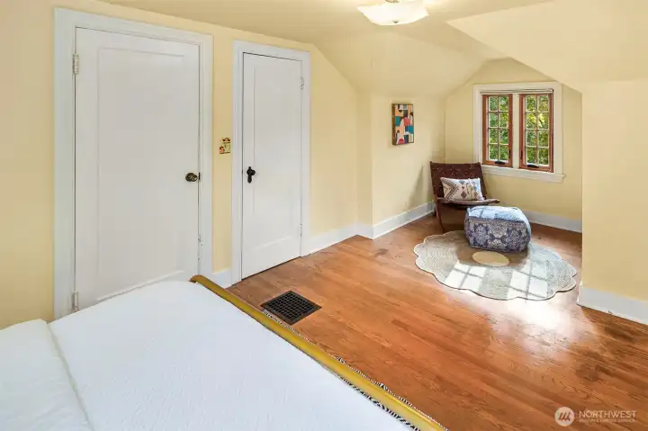 Second upstairs bedroom with reading or desk space.