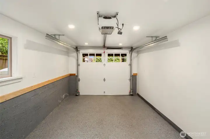 One car garage is accessible from alley. Additional uncovered parking space in driveway.