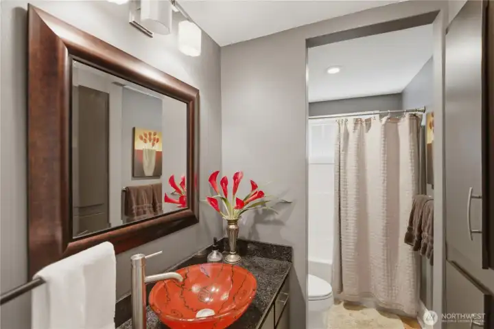 Main level full bath to service guest bedroom