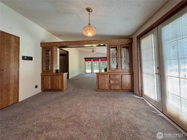 Dining area next to patio French Doors, and in-wall radio Dining area next to patio French Doors, and in-wall radio