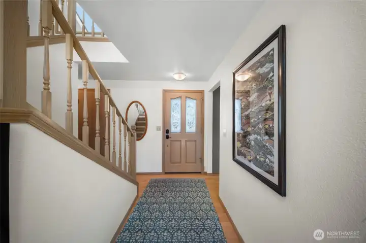 Entry way features Hardwood floors.