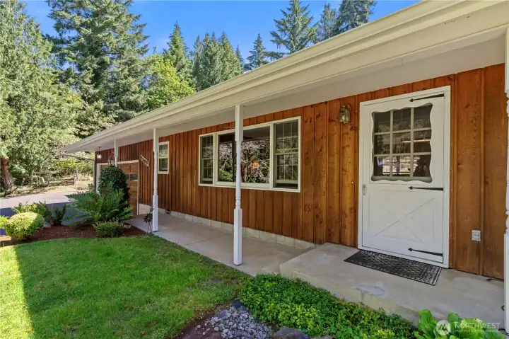 Inviting covered front porch offers the perfect place to take in the peaceful country setting in this desirable one level home.