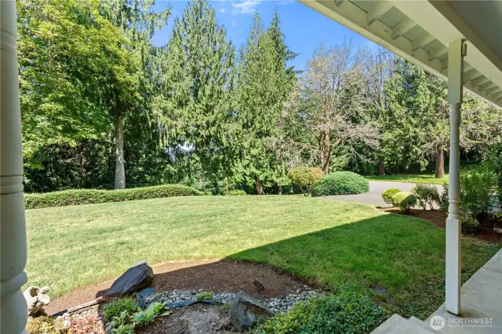 Front yard offering open green space and a peaceful setting. Septic system is located in the front yard area.