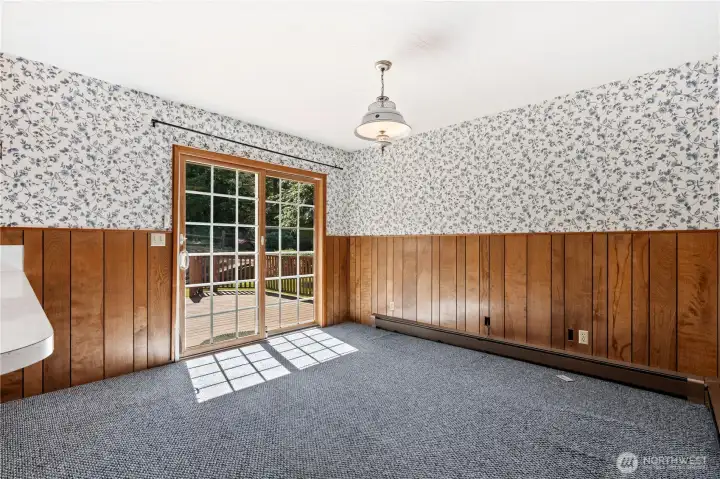 Dining area conveniently located adjacent to the kitchen with access to the rear deck.