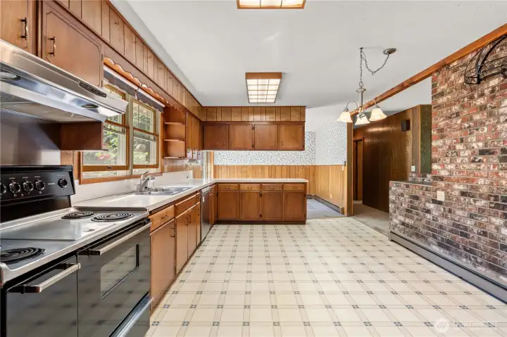 A unique oversized range with center griddle adds both character and functionality to the kitchen.
