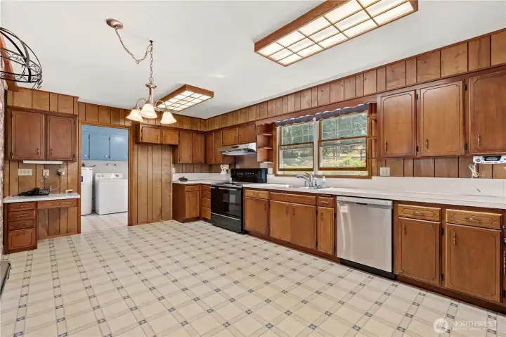 Functional kitchen with abundant cabinet space and room to personalize.