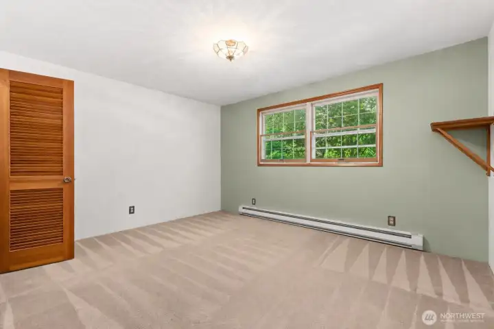 Primary bedroom offering peaceful views.