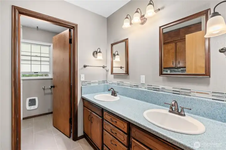 The spacious dual-sink vanity provides both style and everyday functionality.