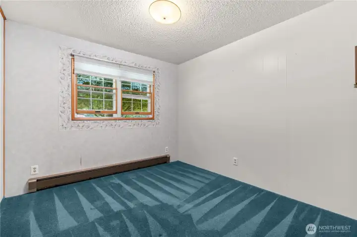 Second bedroom with flexible use for guests or a home office.