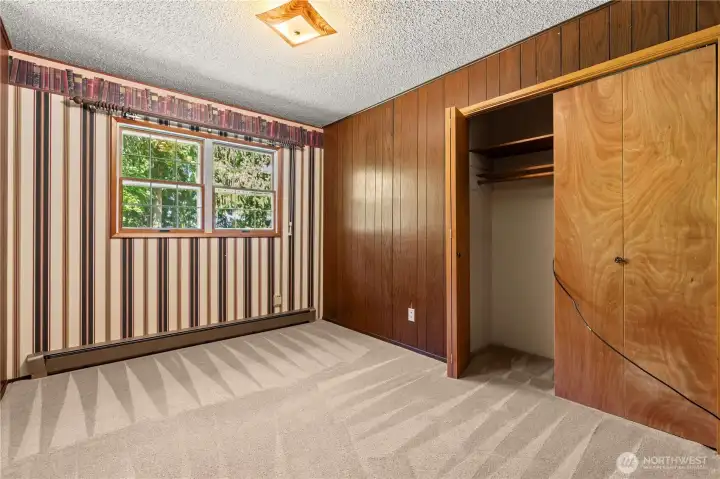 Fourth bedroom provides additional room for guests, hobbies, or office space.