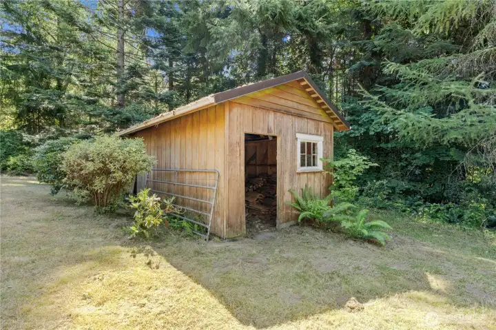 Shed / wood storage shed.
