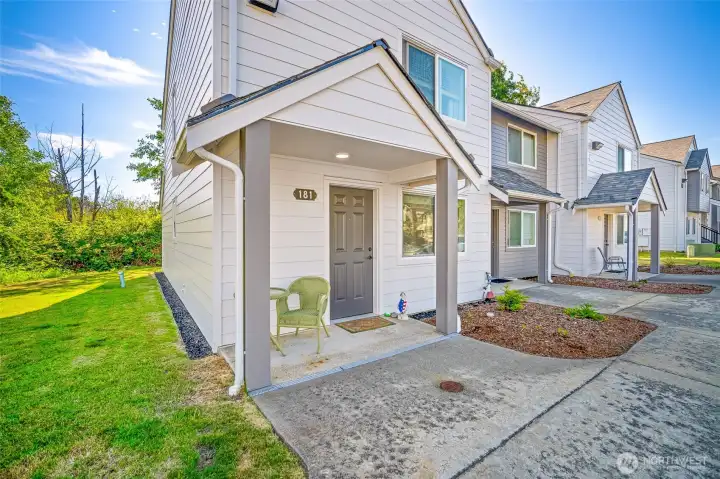 Covered front porch into the unit.