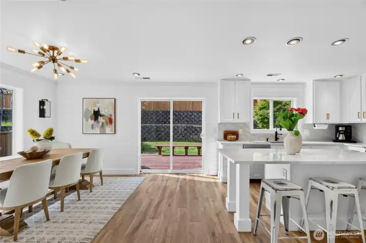 Spacious dining and kitchen area leading to the backyard. Spacious dining and kitchen area leading to the backyard.