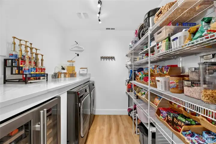 Amzaing pantry/laundry room with beverage fridge. Amzaing pantry/laundry room with beverage fridge.