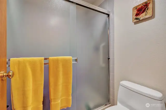 Step in shower in primary bath has grab bars for your safety.