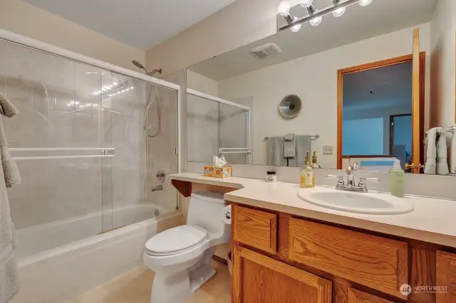 Upper level full guest bathroom. Vanity with storage. Hallway linen closet for all the bath necessities.