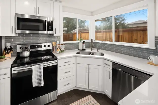 Corner windows create a bright and welcoming environment for cooking and preparing meals