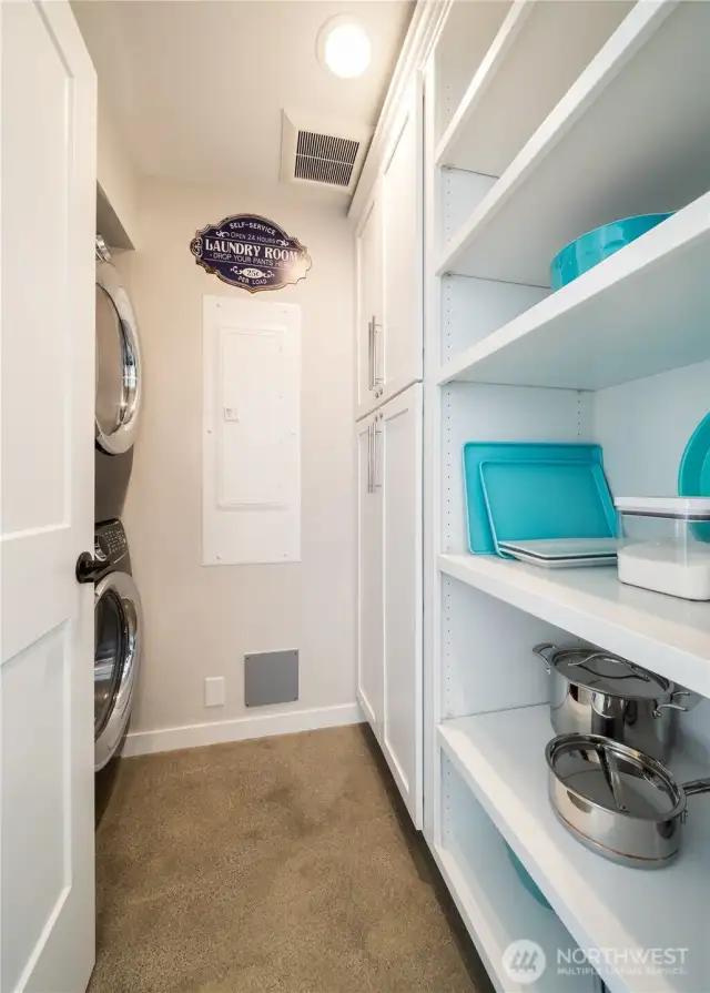 A pantry area and utility room is just off the kitchen. Washer/Dryer stay.