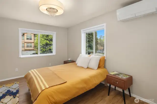 Your primary suite is one of three spacious upper bedrooms, offering east-facing views and plenty of natural light.