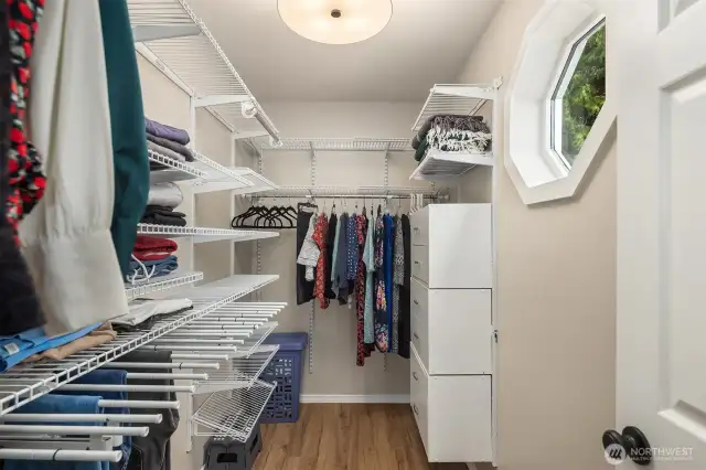 Walk-in closet spacious enough to function as a dedicated styling room.