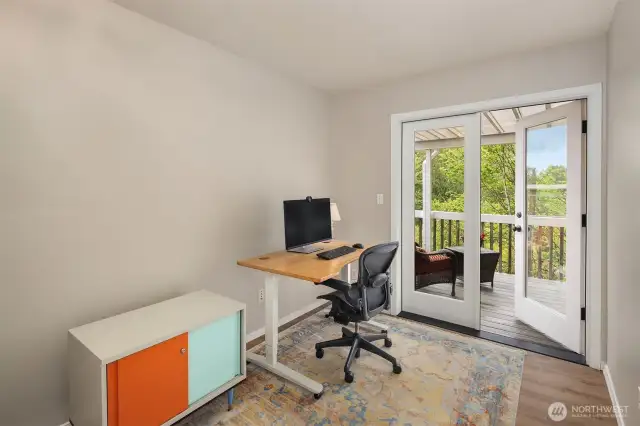 The second bedroom boasts a private entrance to the upper deck, offering seamless indoor-outdoor living.