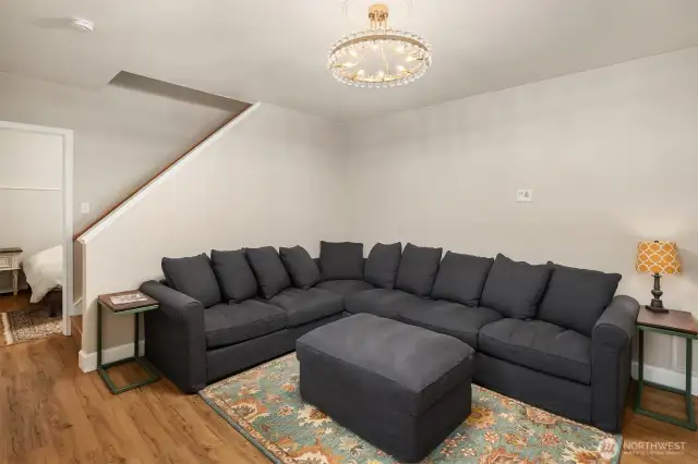 The lower level offers dedicated living space and a media room, perfect for cozy nights in or hosting guests.